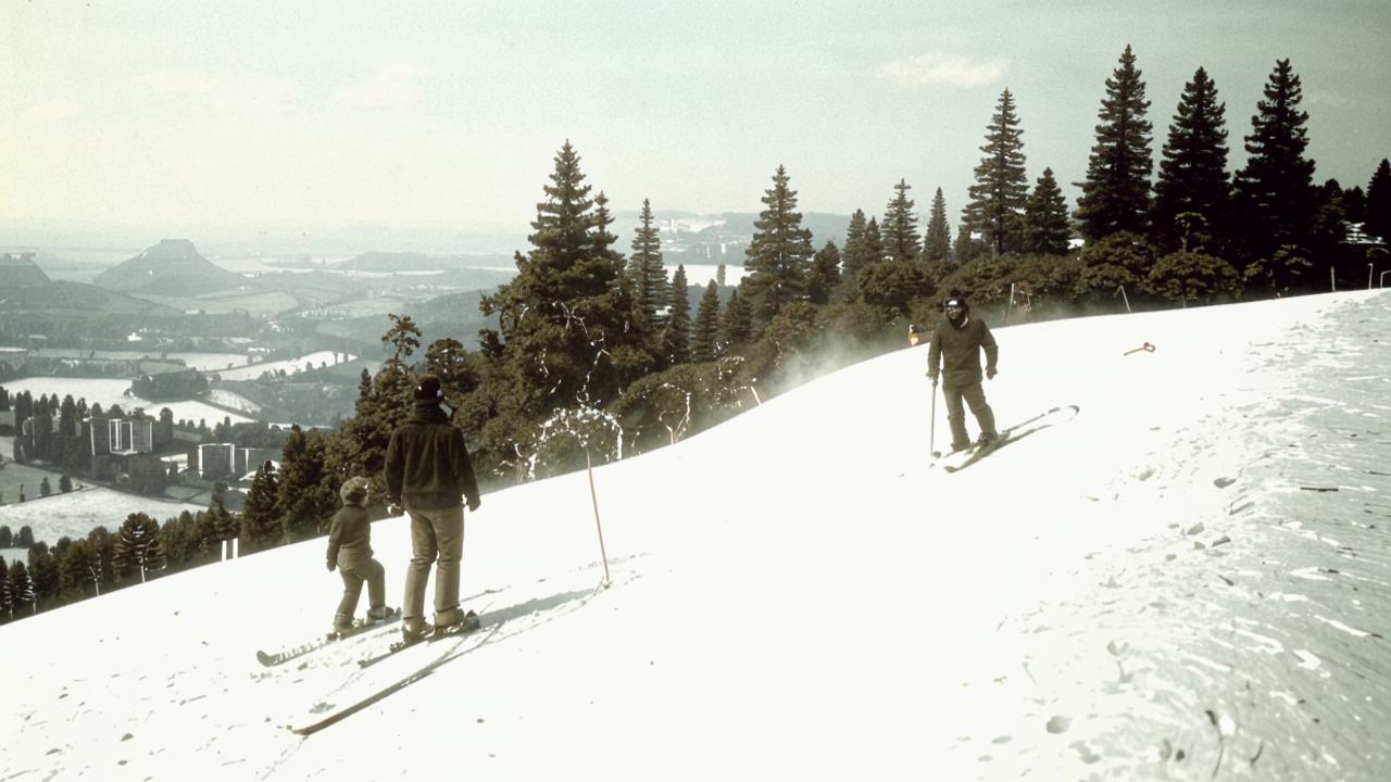 Father and son on snowy peaks